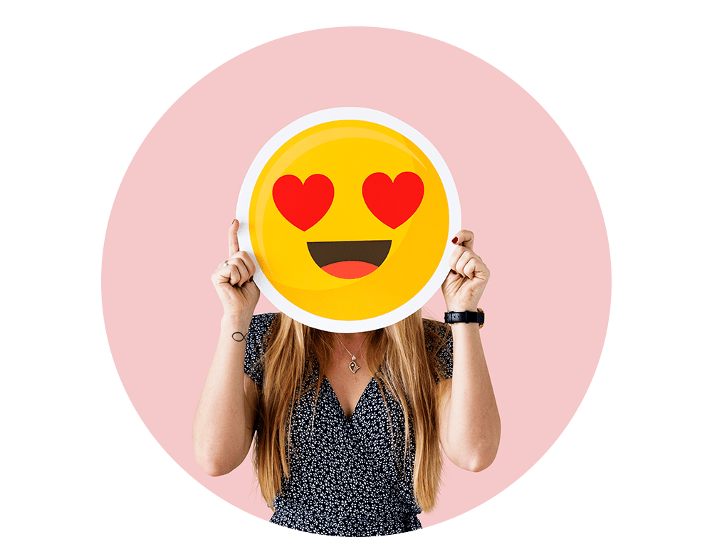cheerful-woman-holding-emoticon-icon